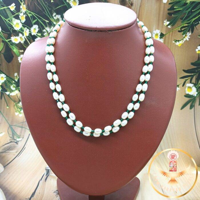 green and white pearl necklace