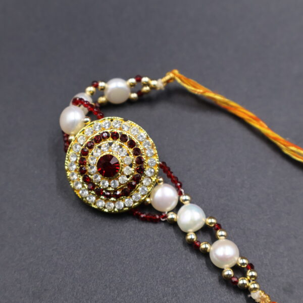 Crimson Elegance Pearl Rakhi - Image 3